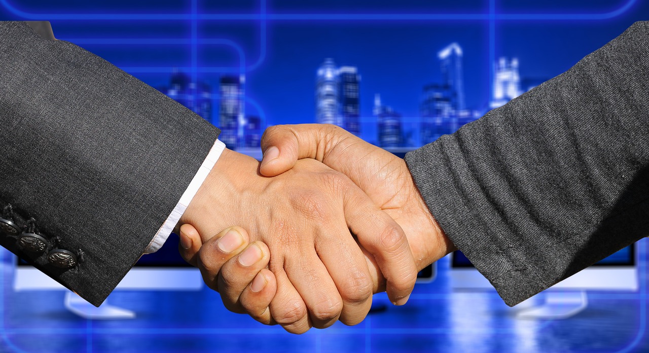 Salesperson shaking hands after closing deal